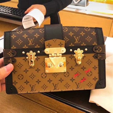 lv trunk clutch black|louis vuitton box clutch.